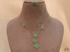 Gold plated necklace set with malachite green clovers