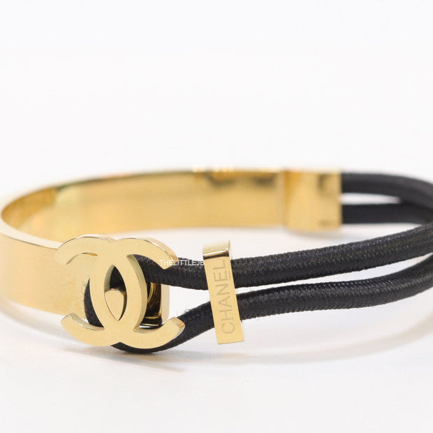 Black and golden designer bracelet with twin C motif
