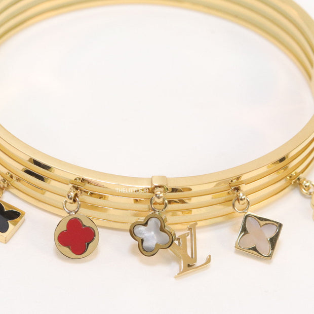 Multilayered golden bracelet with alphabets and coloured clover charms