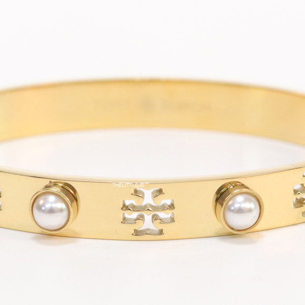 Golden bracelet with pearls and twin T cutwork