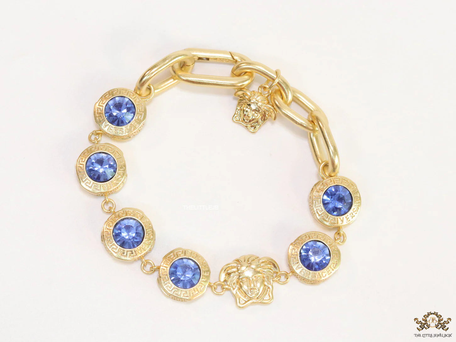 Designer golden Medusa chain bracelet with fancy cut cz