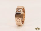 Broad 6mm rose gold band with screws and stones