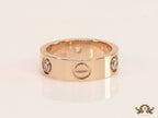 Broad 6mm rose gold band with screws and stones