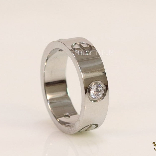Broad 6mm platinum plated band with screws and stones