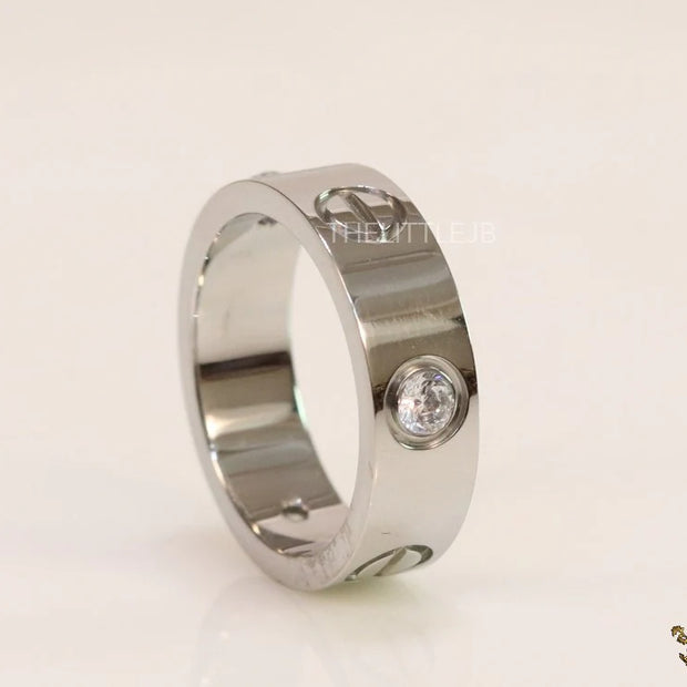 Broad 6mm platinum plated band with screws and stones