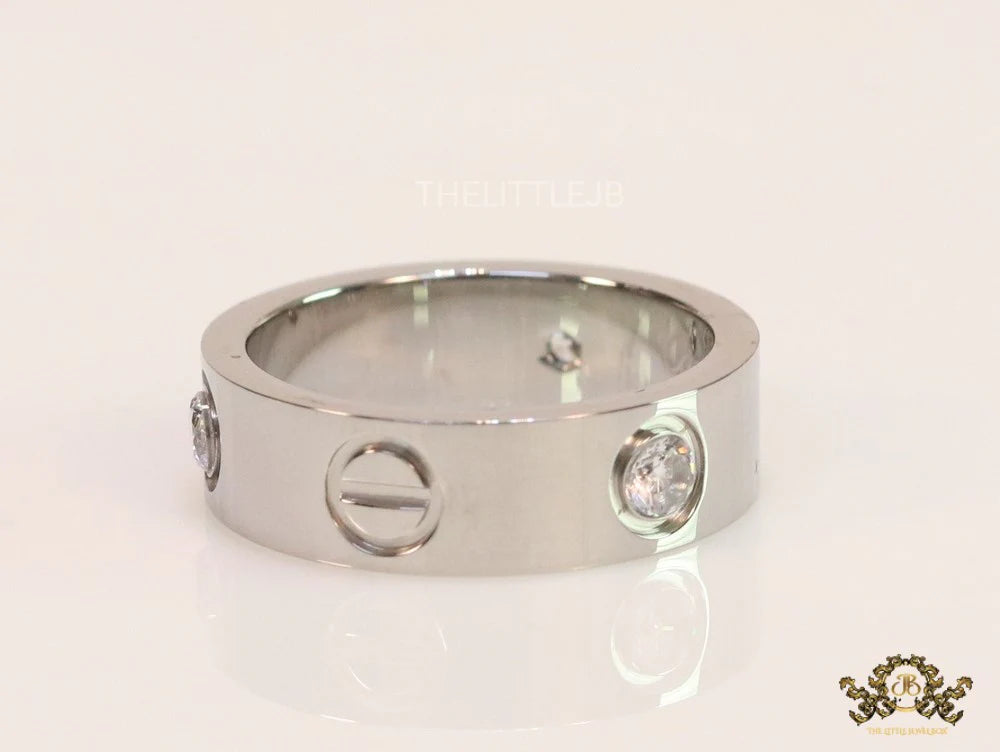 Broad 6mm platinum plated band with screws and stones