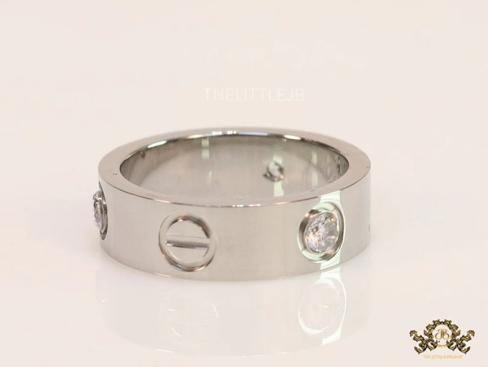 Broad 6mm platinum plated band with screws and stones