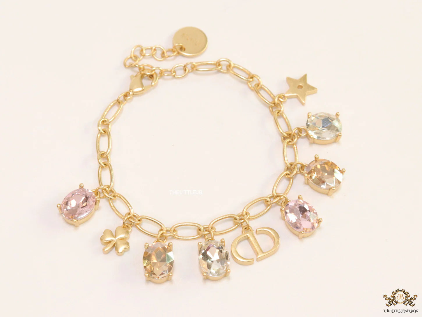 Golden chain bracelet with alphabet and cz charms