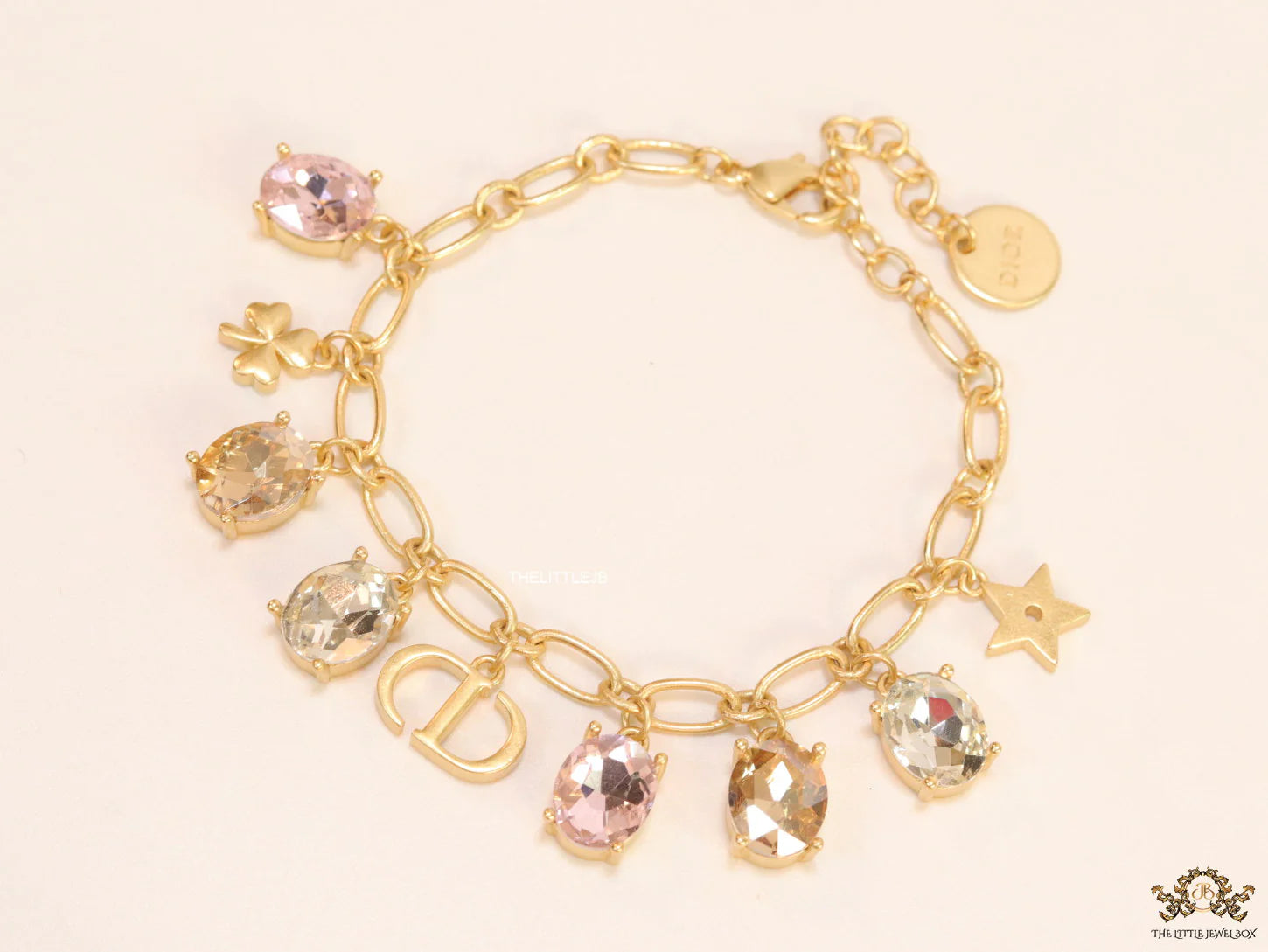 Golden chain bracelet with alphabet and cz charms