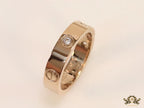 Narrow 4.5mm rose gold band with screws and stones