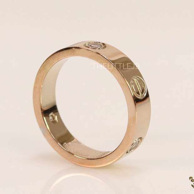 Narrow 4.5mm rose gold band with screws and stones
