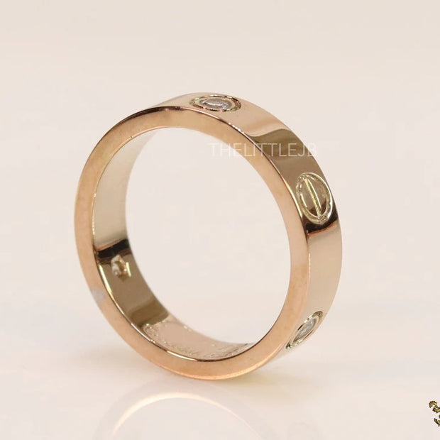 Narrow 4.5mm rose gold band with screws and stones
