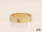 Broad 6mm gold plated band with screws and stones