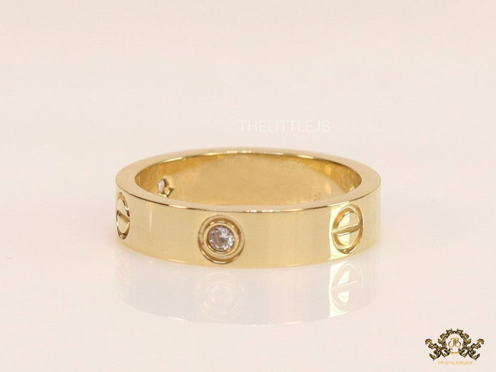 Narrow 4.5mm gold band with screws and stones