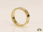 Narrow 4.5mm gold band with screws and stones