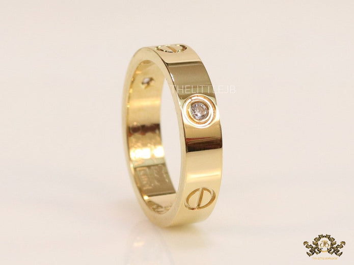 Narrow 4.5mm gold band with screws and stones