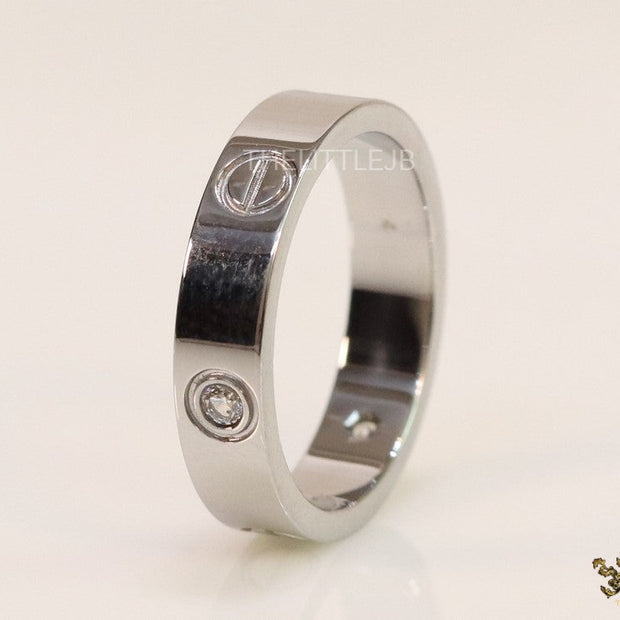 Narrow 4.5mm platinum plated band with screws and stones
