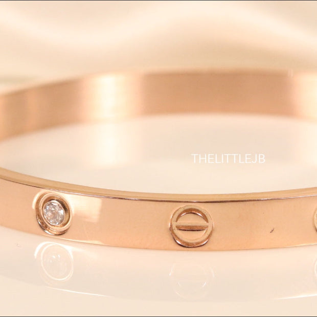 Women's Rose Gold Plated bracelet with screws and zircons