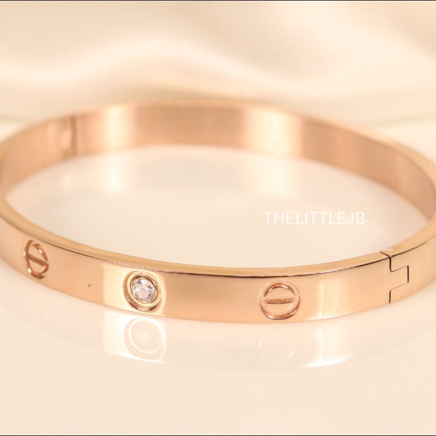 Women's Rose Gold Plated bracelet with screws and zircons