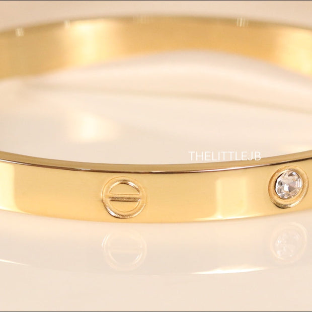 Women's Gold Plated bracelet with screws and zircons