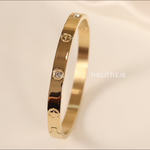Women's Gold Plated bracelet with screws and zircons