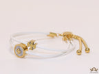 Adjustable double string white bracelet with twin T motifs