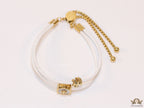 Adjustable double string white bracelet with twin T motifs