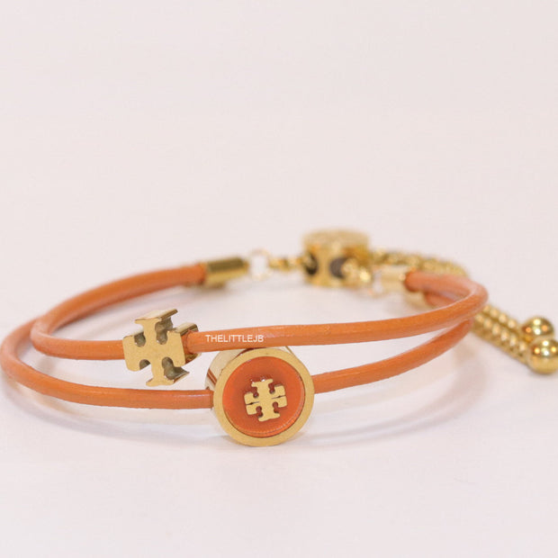 Adjustable double string orange bracelet with twin T motifs