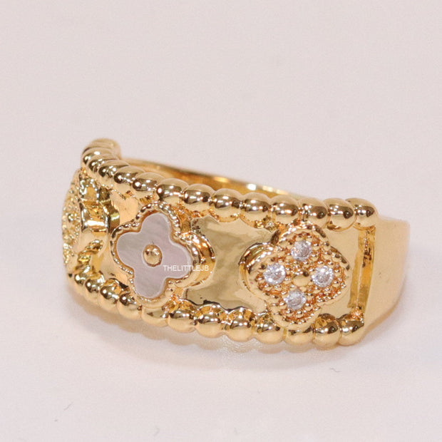 Golden ring band with MOP and cz clovers