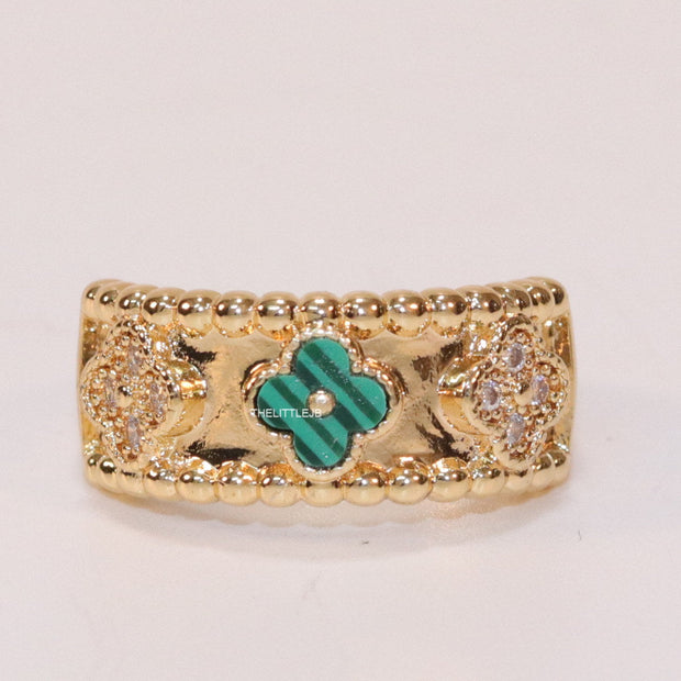 Golden ring band with malachite green and cz clovers