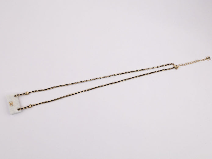 Double C enamel Bag on a black and gold chain