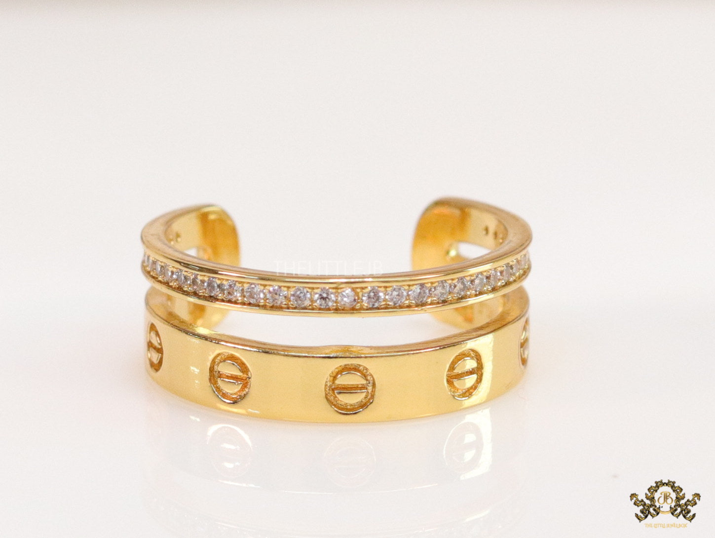 Double layered gold finish open ring with screws and cz