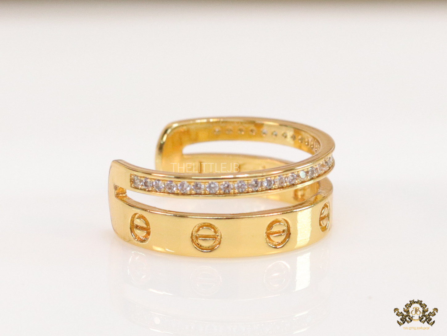 Double layered gold finish open ring with screws and cz