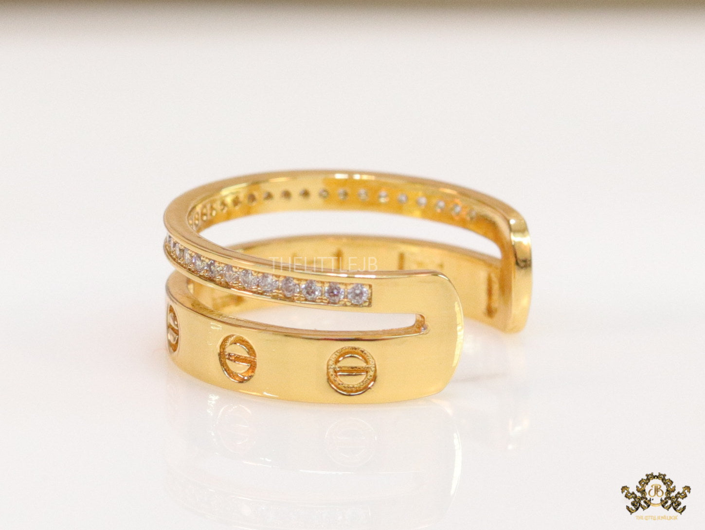 Double layered gold finish open ring with screws and cz