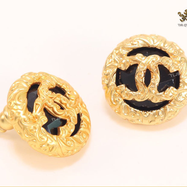 Black and gold double C studs