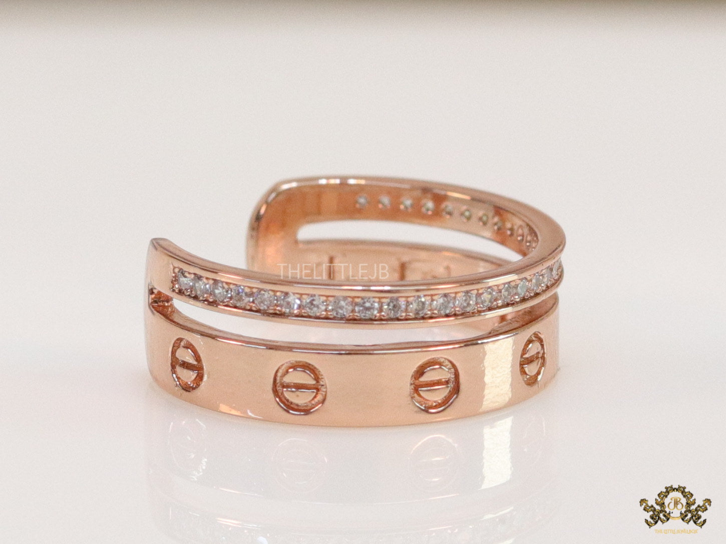 Double layered rose gold finish open ring with screws and cz