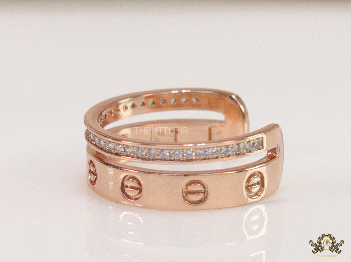Double layered rose gold finish open ring with screws and cz