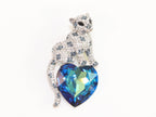 Panther on heart-shaped London blue topaz brooch