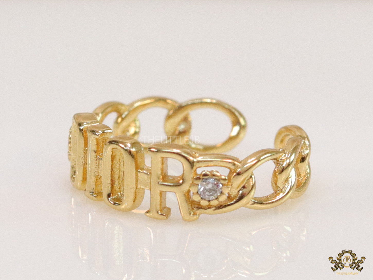 Gold plated alphabet open ring with white cz