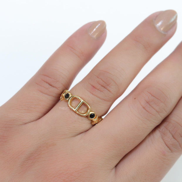 Gold finish alphabet open ring with black cz