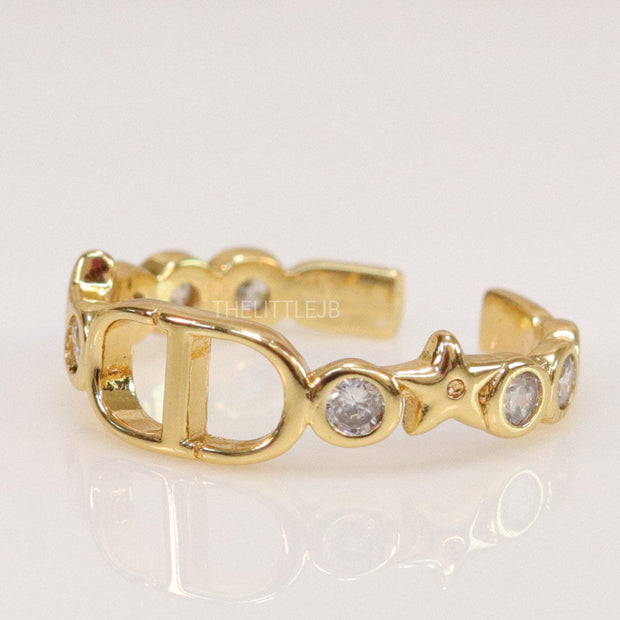 Gold finish alphabet open ring with white cz