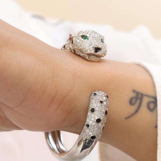 Panther cz platinum bracelet with emerald green stones