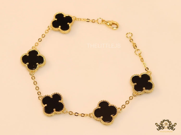 Gold plated chain bracelet with black clover