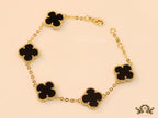 Gold plated chain bracelet with black clover