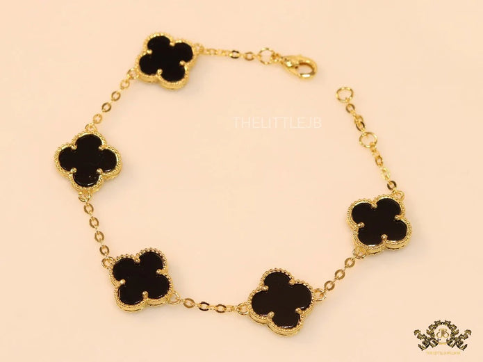 Gold plated chain bracelet with black clover