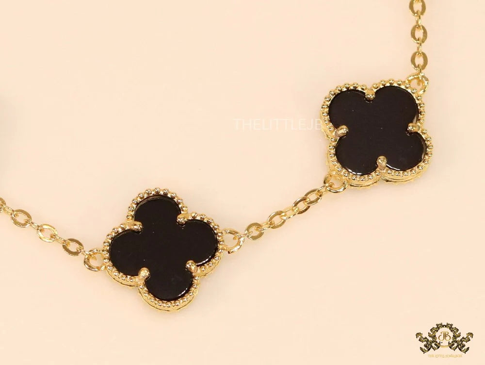 Gold plated chain bracelet with black clover