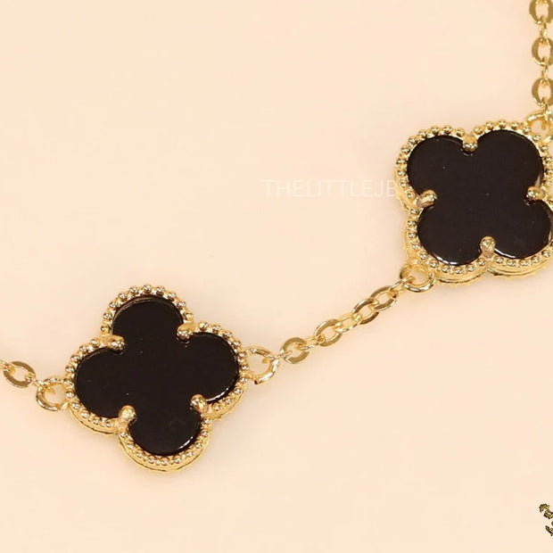 Gold plated chain bracelet with black clover