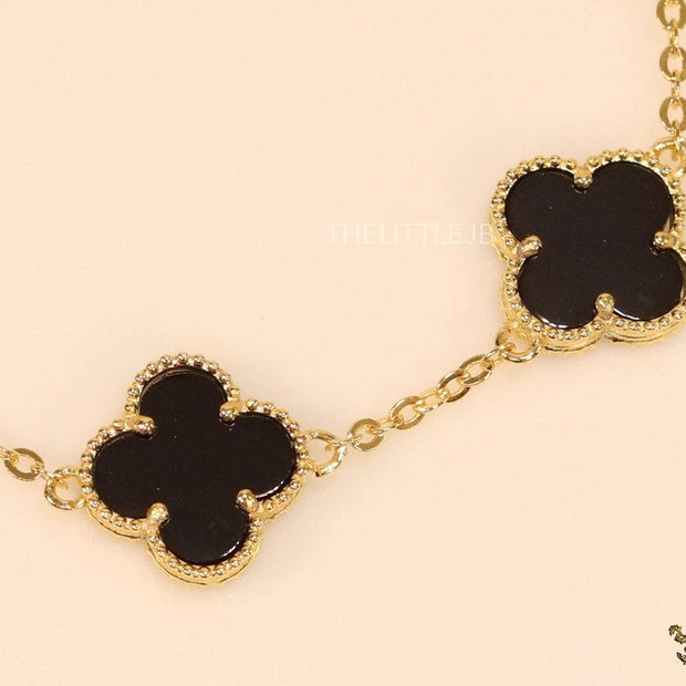 Gold plated chain bracelet with black clover