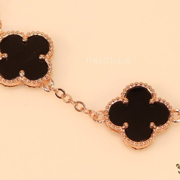 Rose gold plated chain bracelet with black clover