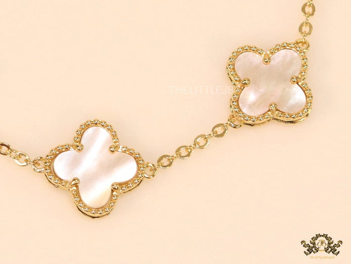 Gold plated chain bracelet with mother of pearl clover